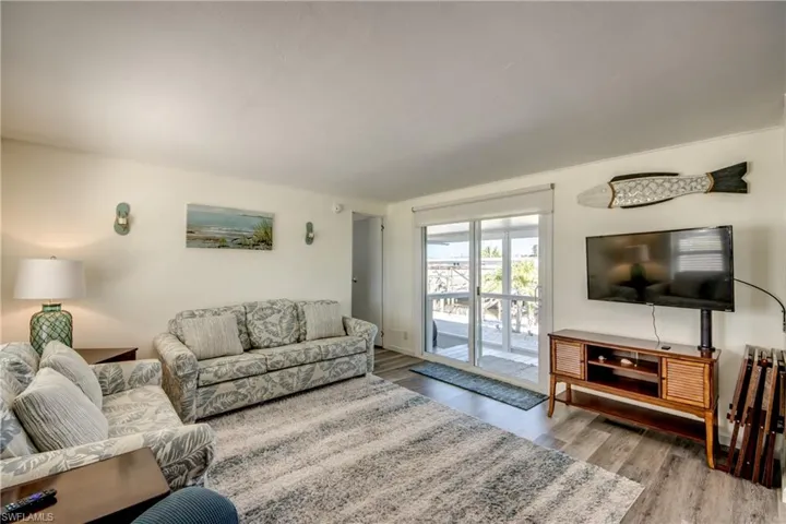 Living area with light wood-type flooring