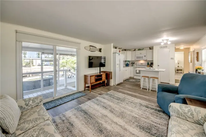 Living room with light wood-type flooring