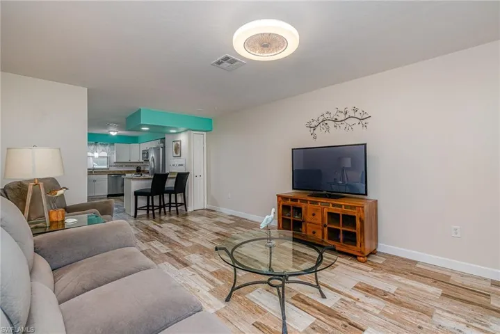 Living room with light hardwood / wood-style floors
