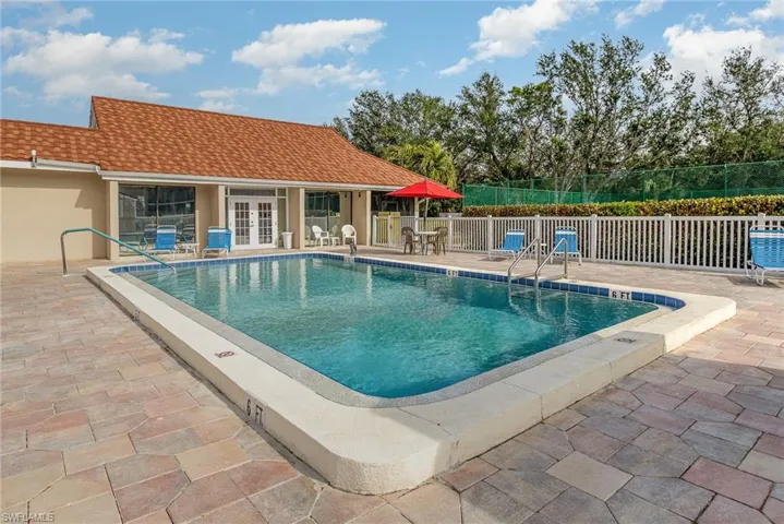 View of swimming pool featuring french doors and a patio