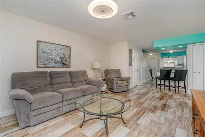Living room with light hardwood / wood-style flooring