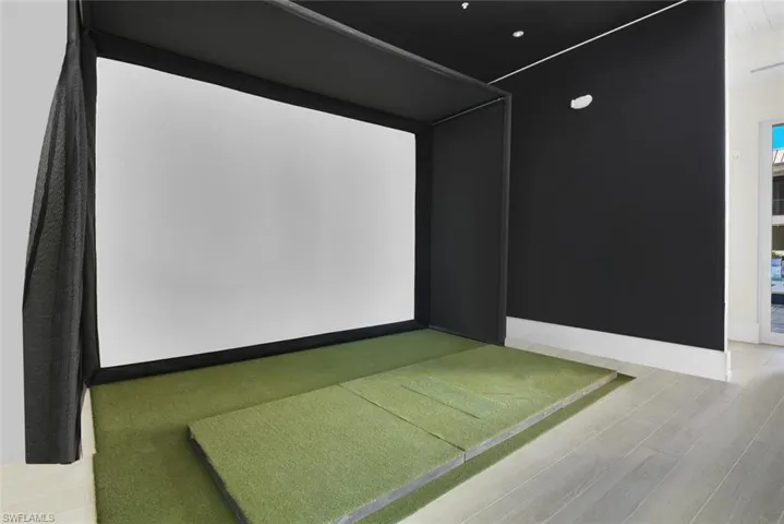 Home theater featuring golf simulator