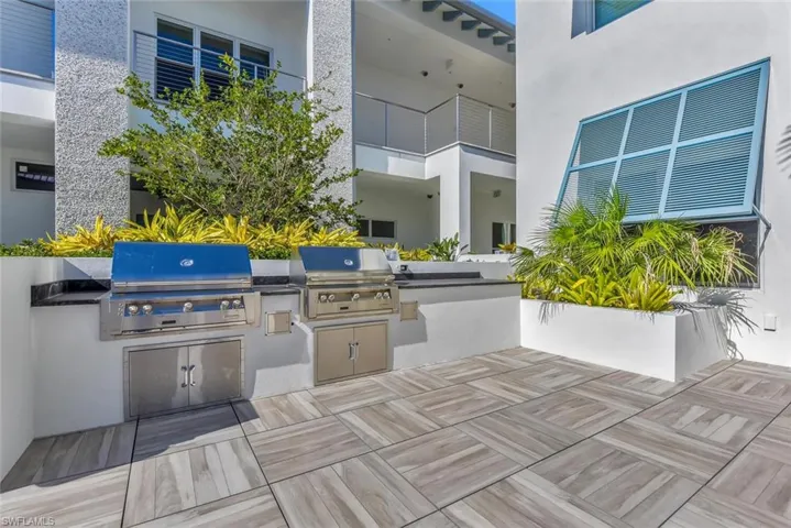 View of patio featuring a grill and area for grilling
