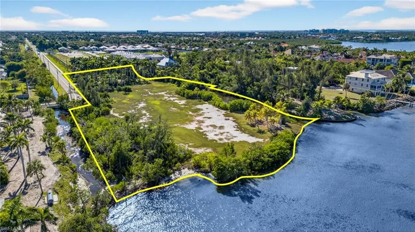 View of property location with a nearby body of water and property boundaries highlighted