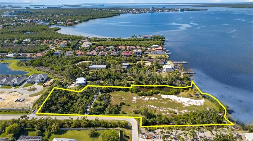 View of property location featuring property boundaries highlighted and a large body of water