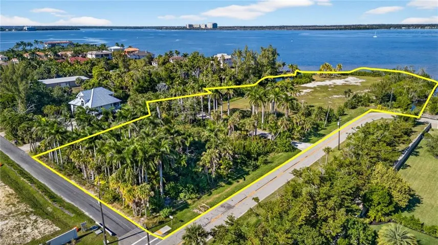 Aerial view of property's location with property boundaries highlighted and a nearby body of water