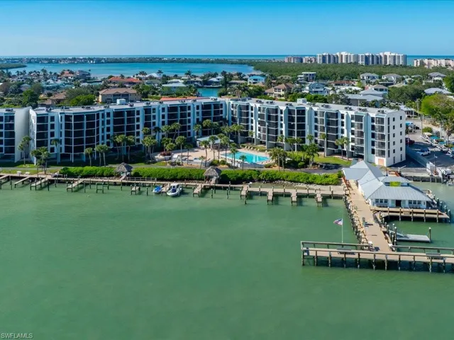 The property features a waterfront location with extensive boat docks and a private dock house