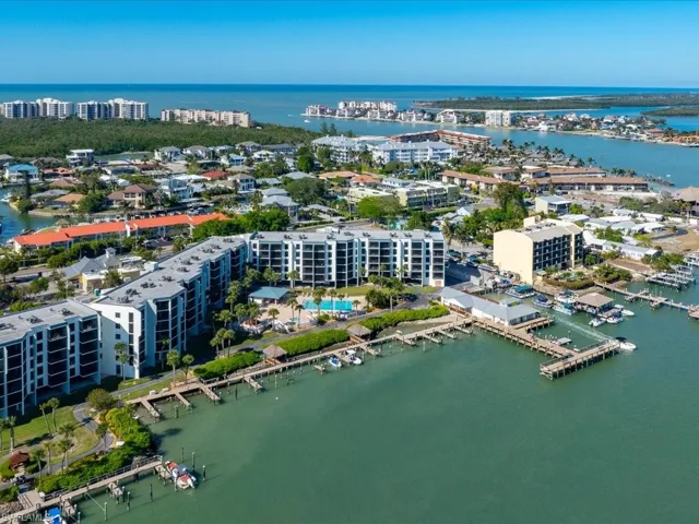 Aerial view showcasing the property's location with direct water access and boat docks