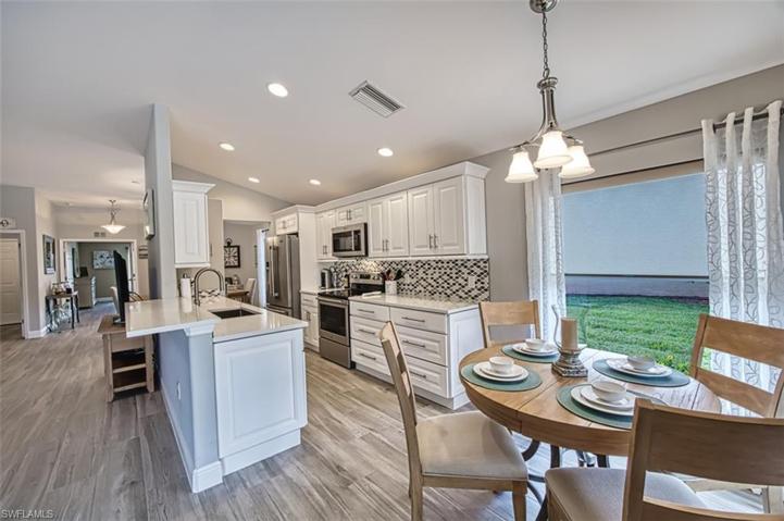 Quartz countertops, finished sides of cabinets, tile backsplash