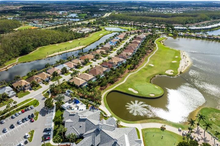 Club house with view of lake and 18th fairway