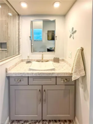 Bathroom featuring vanity and recessed lighting
