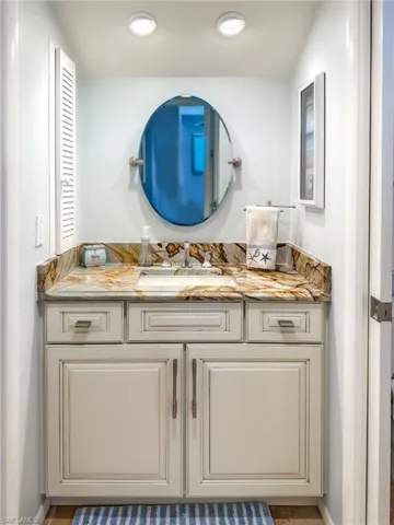 Bathroom featuring vanity and recessed lighting