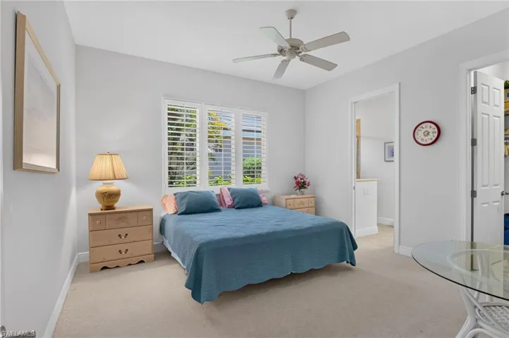 Guest bedroom with walk in closet and ensuite bathroom.
