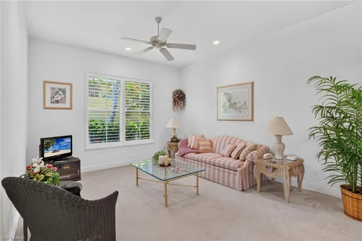 Large guest bedroom being used as a sitting area.