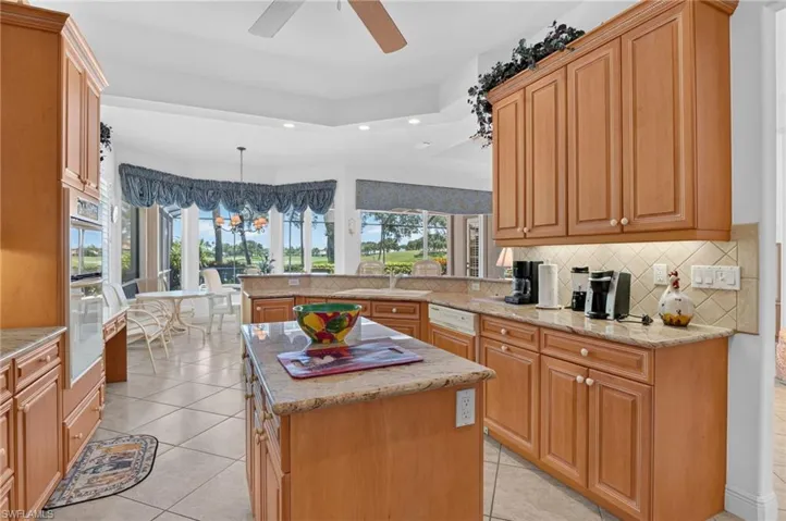 Enjoy the golf course and lake views while in the kitchen. Copious countertop space offers multiple food preparation surfaces.