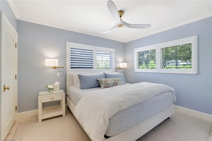 Bedroom featuring crown molding and ceiling fan