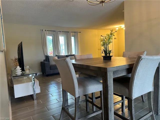 Dining area featuring a wood-finish dining table and coordinated seating