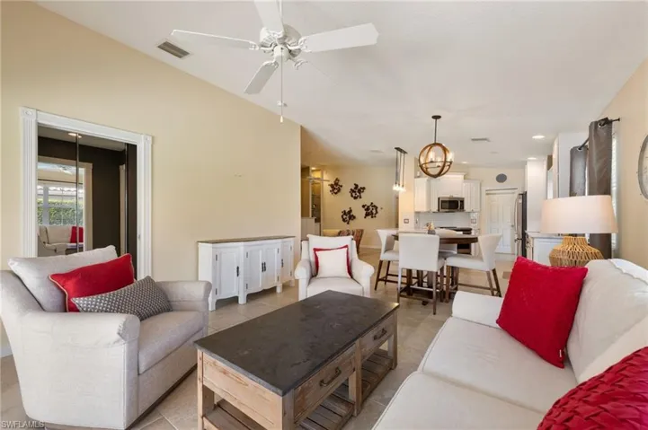 15339 Upwind Dr Bonita Springs FL 34135 - A pocket door closes owner's suite off from open den area