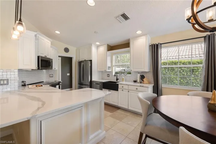 15339 Upwind Dr Bonita Springs FL 34135 - Kitchen with access from the outside of the corner cabinet, making full use of corner cabinet.