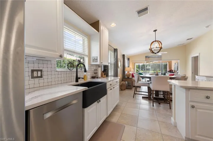 15339 Upwind Dr Bonita Springs FL 34135 - Kitchen with adjacent dining area