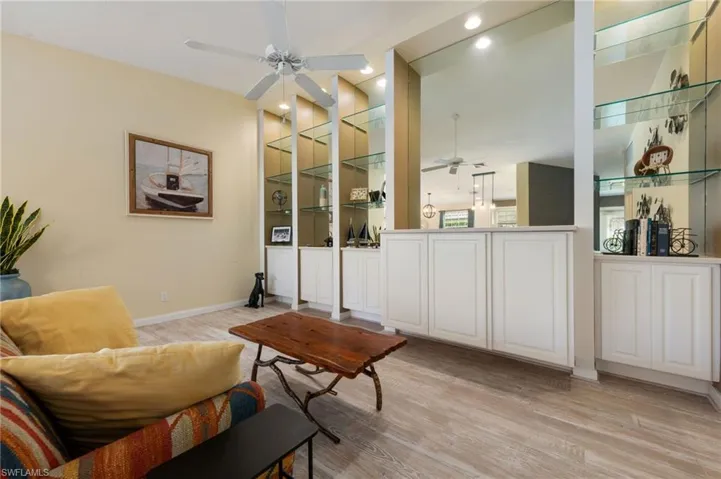 15339 Upwind Dr Bonita Springs FL 34135 - Lighted wall unit with TV cabinet and glass shelving
