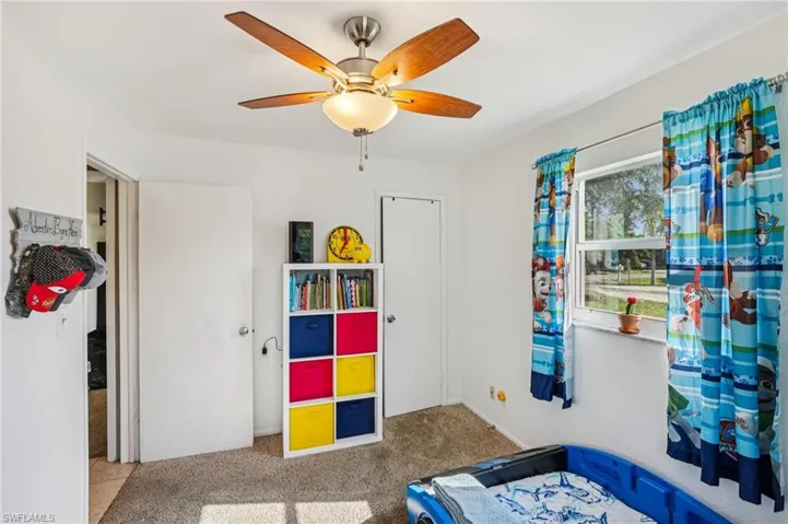 Bedroom with carpet floors and ceiling fan