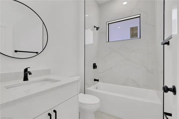 Guest bathroom with vanity and shower / bathtub combination