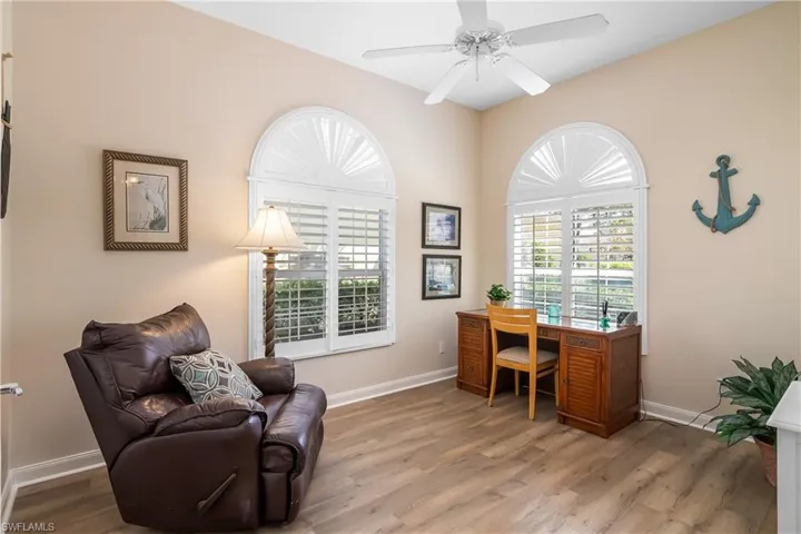 Office/den space featuring engineered waterproof flooring and ceiling fan