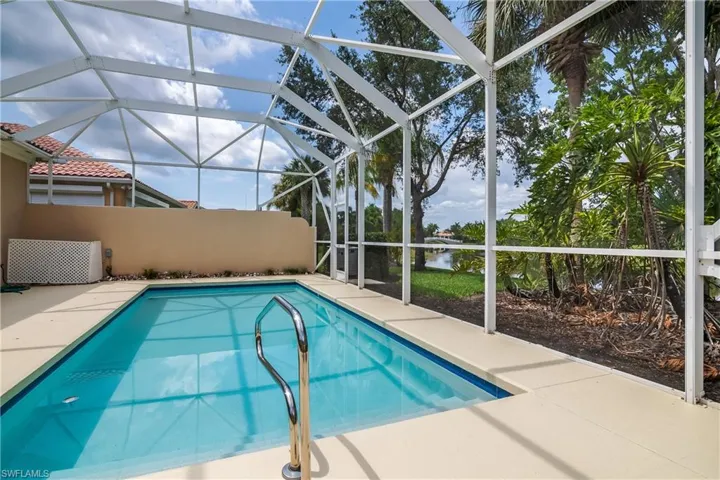 View of pool with bridge in background