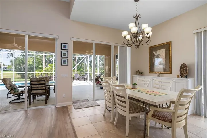 Tiled dining space with an inviting chandelier