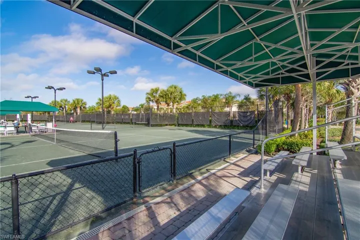 View of sports courts which include 8 Har Tru tennis courts and 3 Pickleball courts, with seating in pavilion as well for viewing play