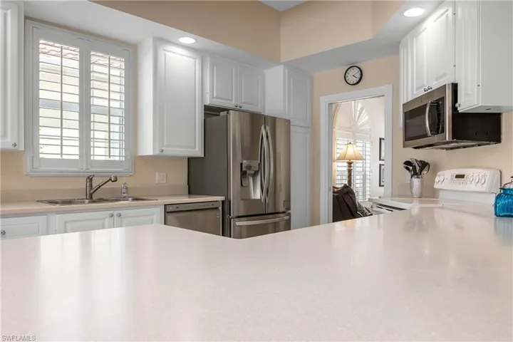 Kitchen featuring opening into cozy Den/Office area. Pocket door for privacy