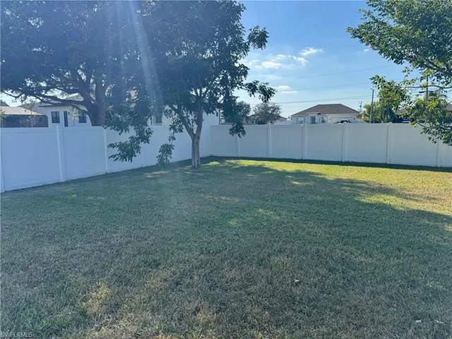 View of fenced backyard