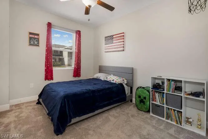 Bedroom with carpet and ceiling fan