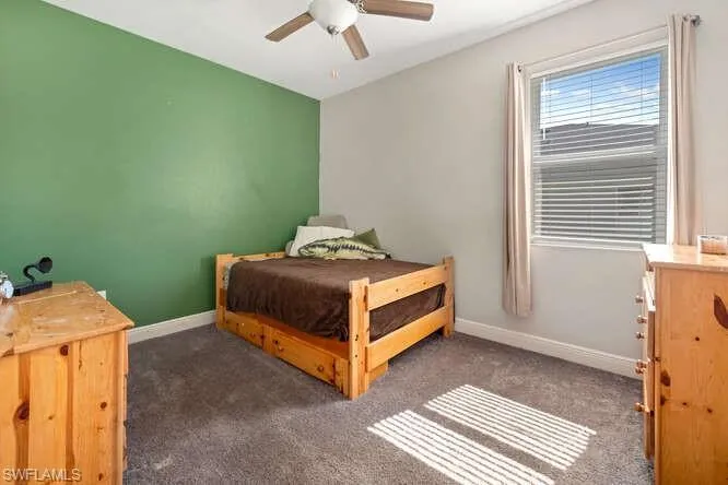 Bedroom featuring carpet and ceiling fan