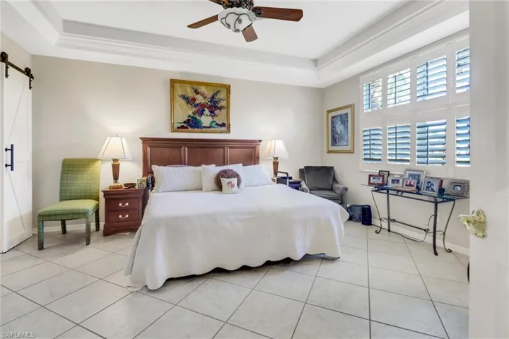 Barn door separates main bedroom and closets.