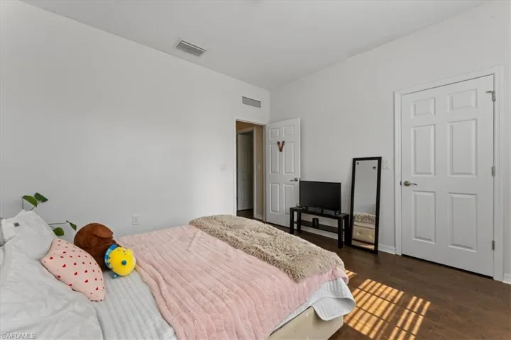 Bedroom with wood finished floors