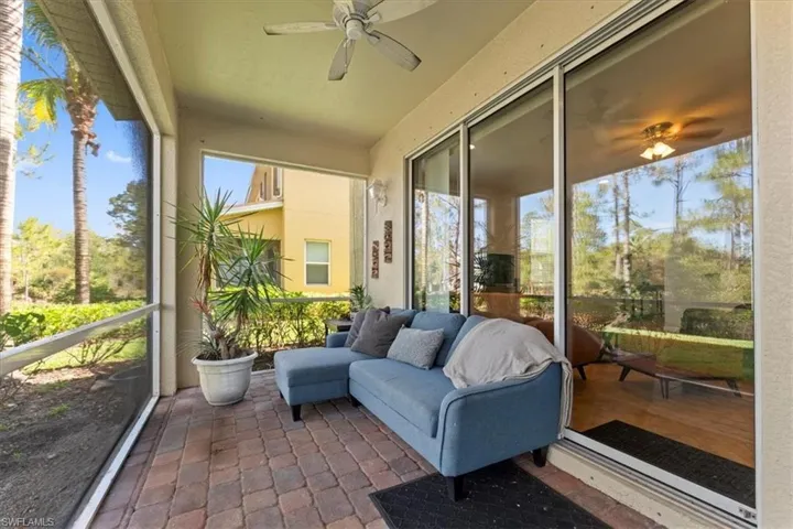 Sunroom / solarium featuring ceiling fan