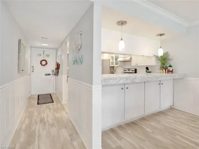 Extra cabinet storage beneath breakfast bar