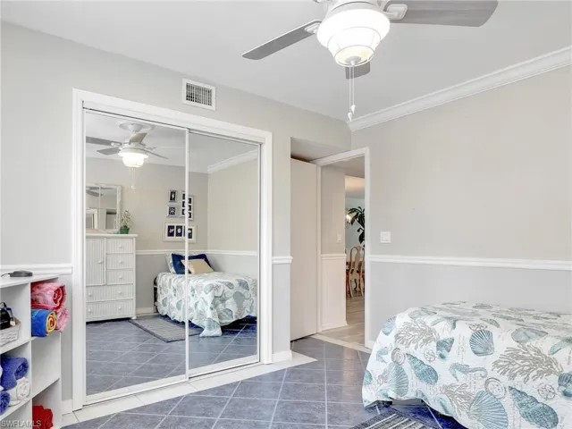 Large guest closet with mirrored sliding doors