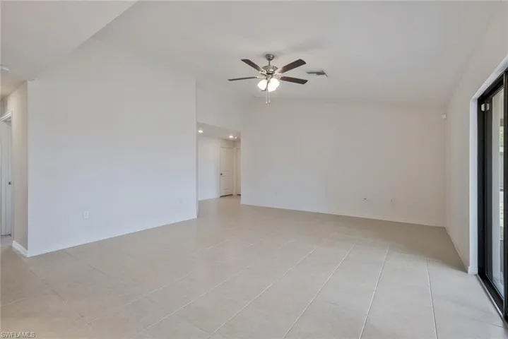 Unfurnished room featuring ceiling fan and light tile patterned floors