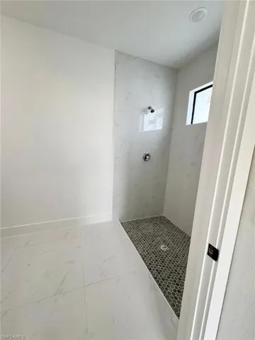 Bathroom featuring tiled shower