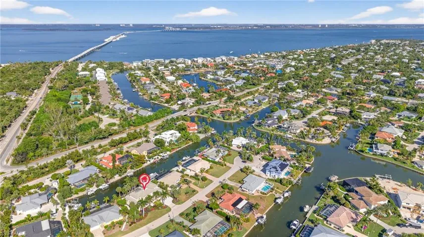 View of property location with a large body of water and nearby suburban area