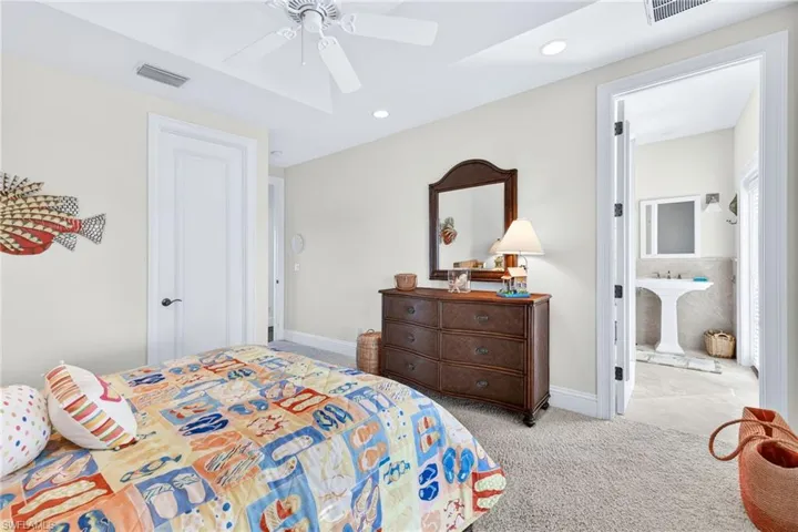 Bedroom featuring carpet floors, recessed lighting, and a ceiling fan