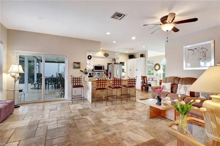 Open floor plan has family room opening to the kitchen bar and the Deck.