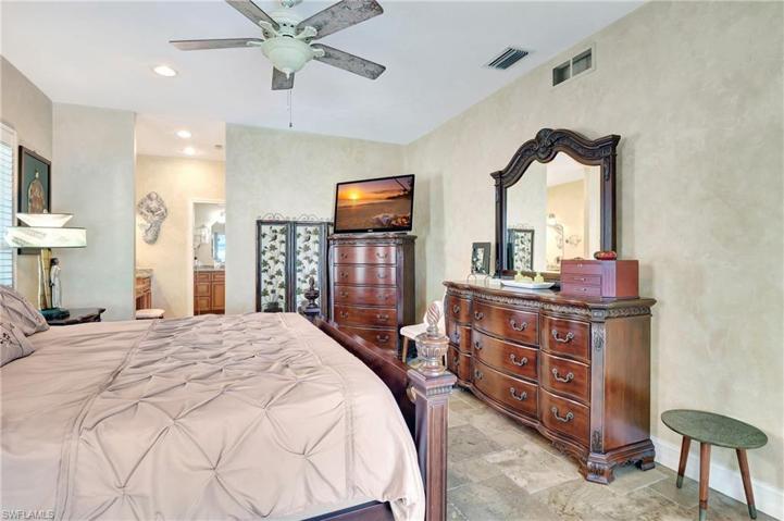 Spacious master suite with sliders to pool deck, fan, triple vanity ensuite, walk in closet!