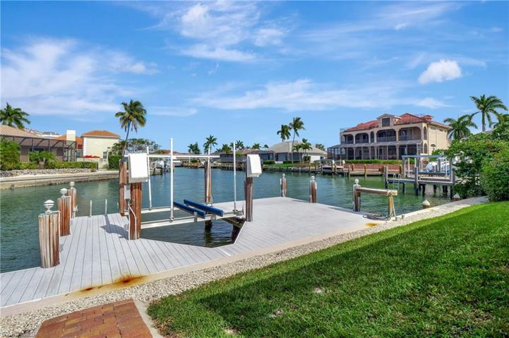 One of TWO boat lifts with newer composite decking, lighting