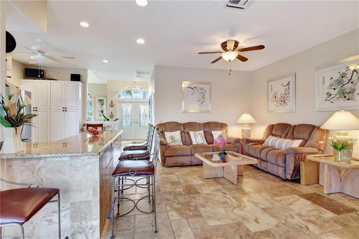 Spacious Family Room opens to kitchen and bar.