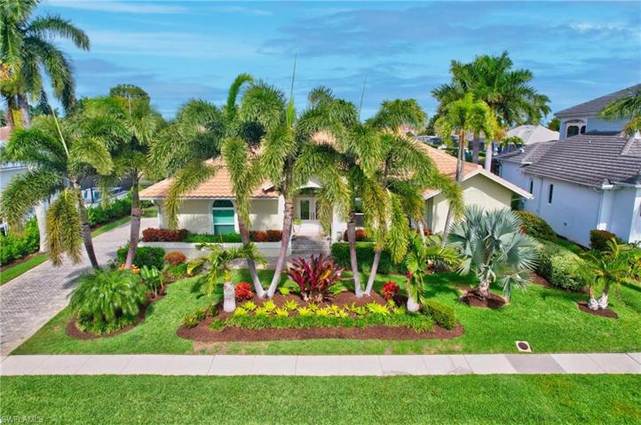 Lush Tropical Landscaping, paver walkways and driveway.