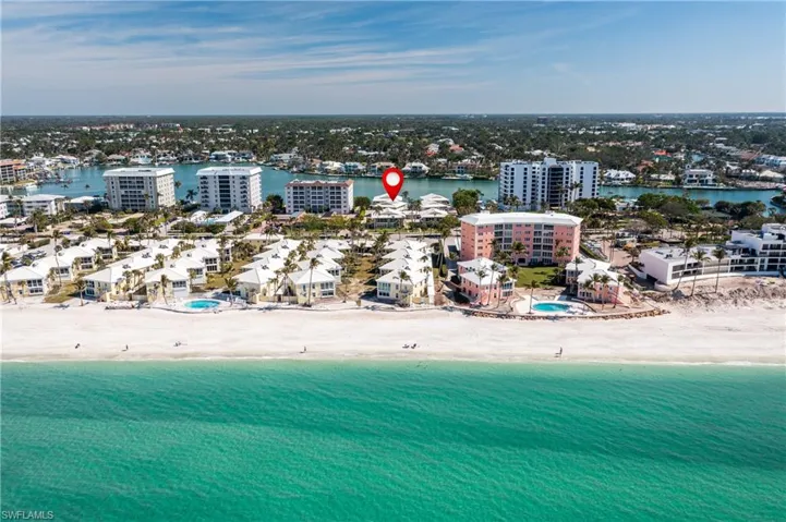 Yacht Harbor Manor is on Moorings Bay, with beach access just to the right of the pink building shown in the foreground.